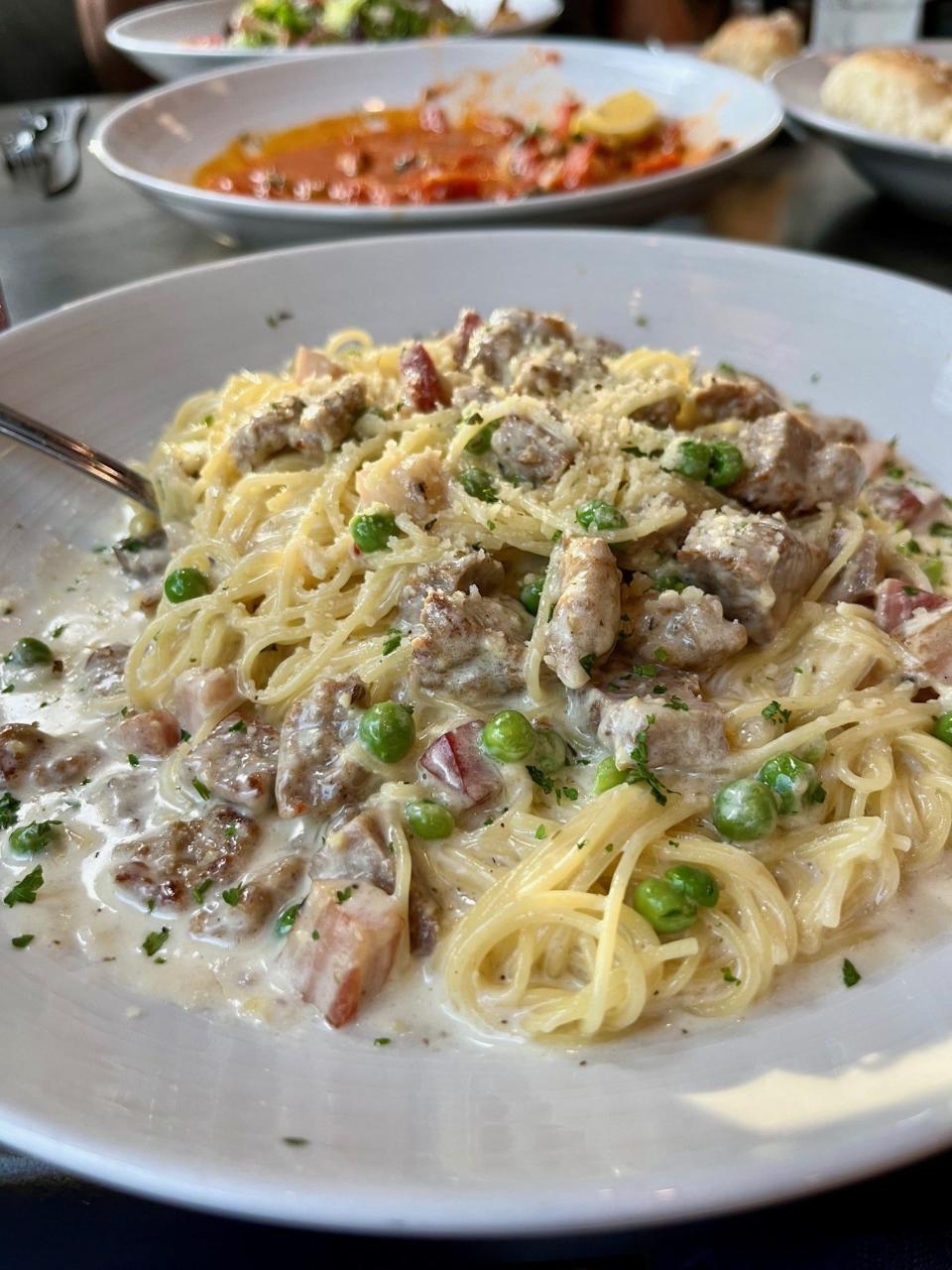 Mama's pasta at Two Meatballs in the Kitchen features diced sausage and meatballs sautéed with pancetta, ricotta and peas served in a cream sauce over pasta.