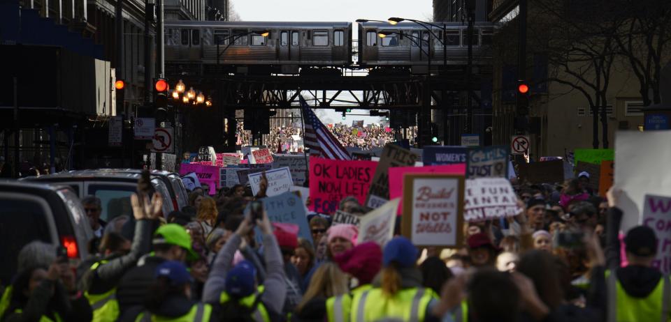 Protesters protest newly inaugurated President Donald Trump during a women's march Saturday, Jan. 21, 2017, in Chicago. (AP Photo/Paul Beaty)