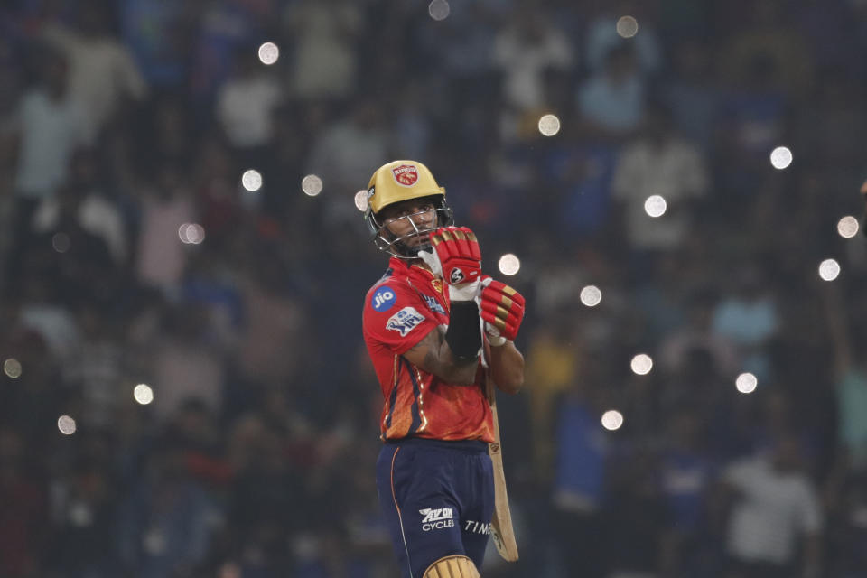 Punjab Kings' captain Shikhar Dhawan adjusts his gloves during the Indian Premier League cricket match between Lucknow Super Giants and Punjab Kings in Lucknow, India, Saturday, March 30, 2024.(AP Photo/Pankaj Nangia)