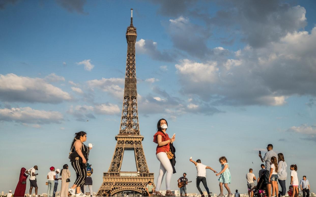 People dance to music at the Trocadero Human Rights Plaza near the Eiffel Tower on June 2 - Shutterstock