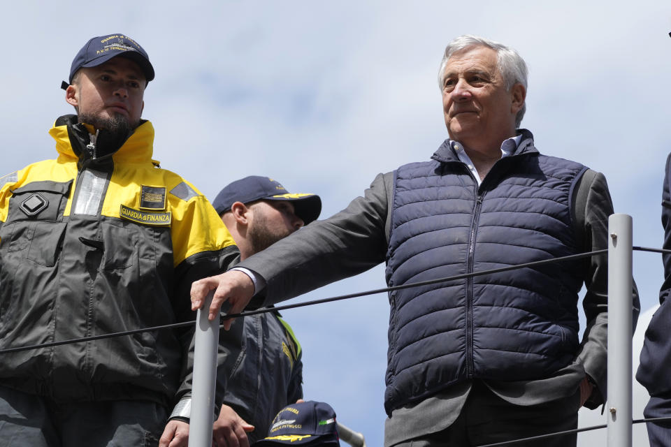 Italian Foreign Minister Antonio Tajani, right, is flanked by an Italian Finance Police officer during an interview with The Associated Press as he arrives for a G7 Foreign Ministers meeting in the Italian southern island of Capri, Wednesday, April 17, 2024. The Group of Seven foreign ministers are meeting on the Italian resort island of Capri, with soaring tensions in the Mideast and Russia's continuing war in Ukraine topping the agenda. The meeting runs April 17-19. (AP Photo/Gregorio Borgia)