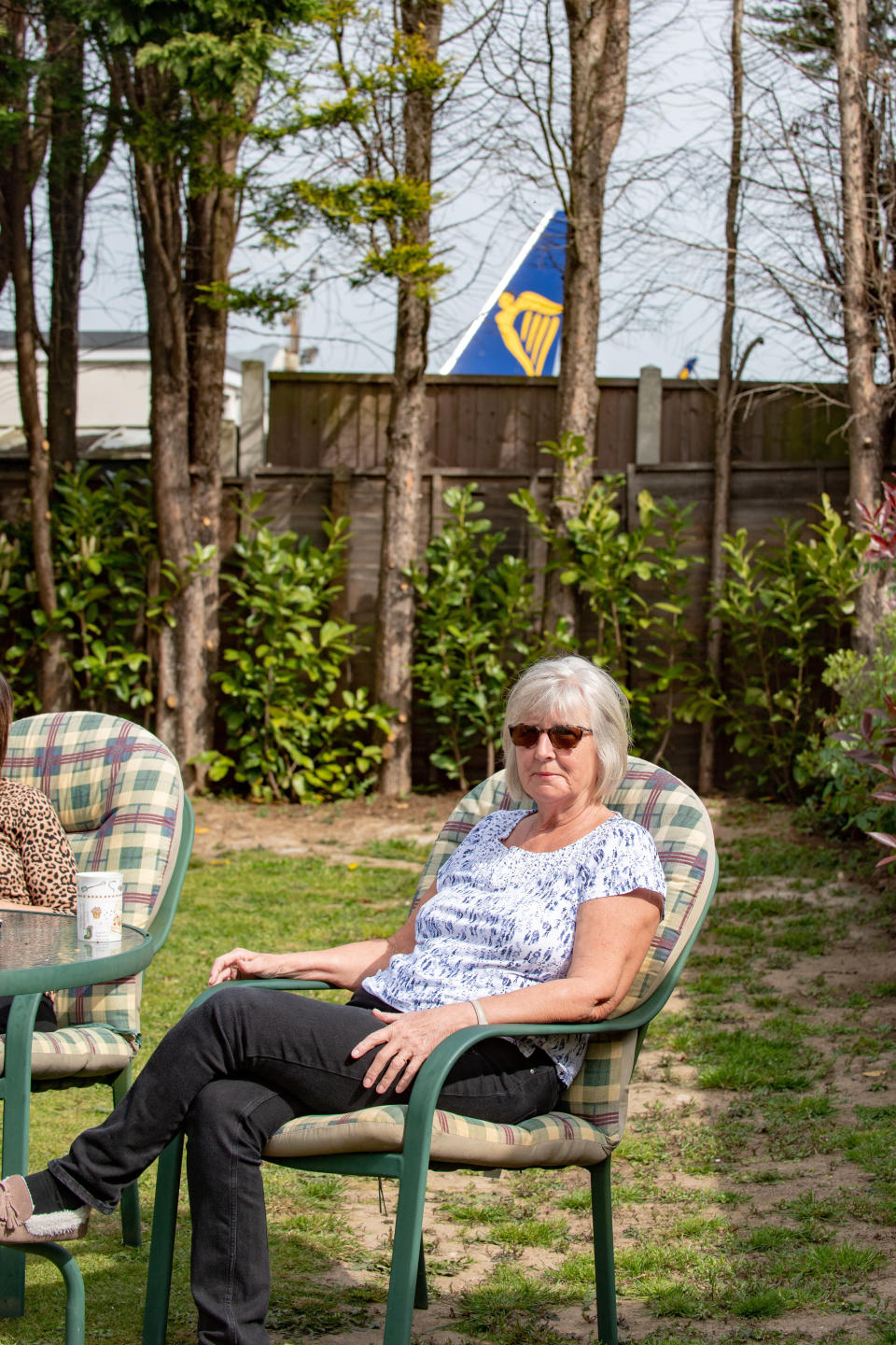 Janet Marchant, 67 in her garden which backs on to Southend Airport in Essex. (SWNS)