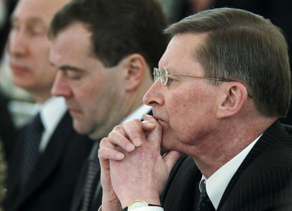 This file photo taken on Monday, Dec. 26, 2011, shows from the left: Russian President Vladimir Putin, Prime Minister Dmitry Medvedev and Kremlin chief of staff Sergei Ivanov listening during a State Council meeting in Moscow's Kremlin, Russia. Ivanov said Sunday Nov. 11, 2012 he was aware of alleged embezzlement of state funds by officials in a company developing Russia's satellite navigation system for several years, but didn't speak publicly about it for several years to prevent the culprits from covering up their deeds.(AP Photo/RIA-Novosti, Mikhail Klimentyev, Presidential Press Service, pool)