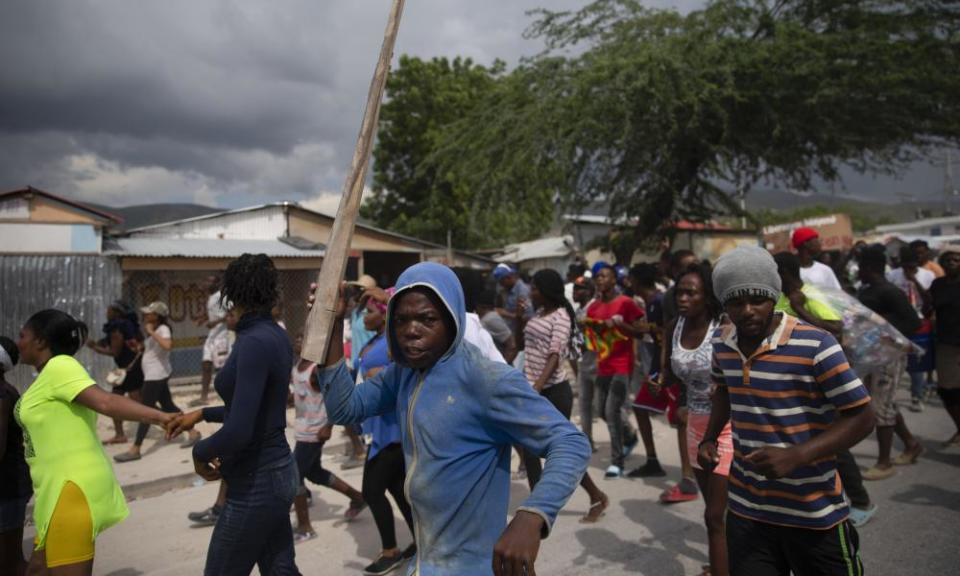 People protest for the release of kidnapped missionaries near the missionaries’ headquarters in Titanyen, north of Port-au-Prince, Haiti, Tuesday, Oct. 19, 2021.