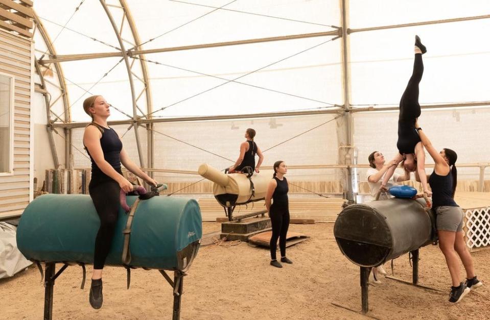 The Oak Hills Vaulting team warms up at practice at Oak Hills Vaulting in Salem on July 7. The team will represent the USA at the FEI Vaulting World Championships for Juniors and Young Vaulters, taking place in Sweden.