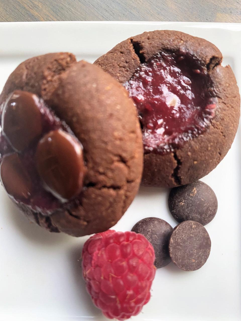Chocolate and raspberries, already a classic combination, make for sweet and tart thumbprint cookies.