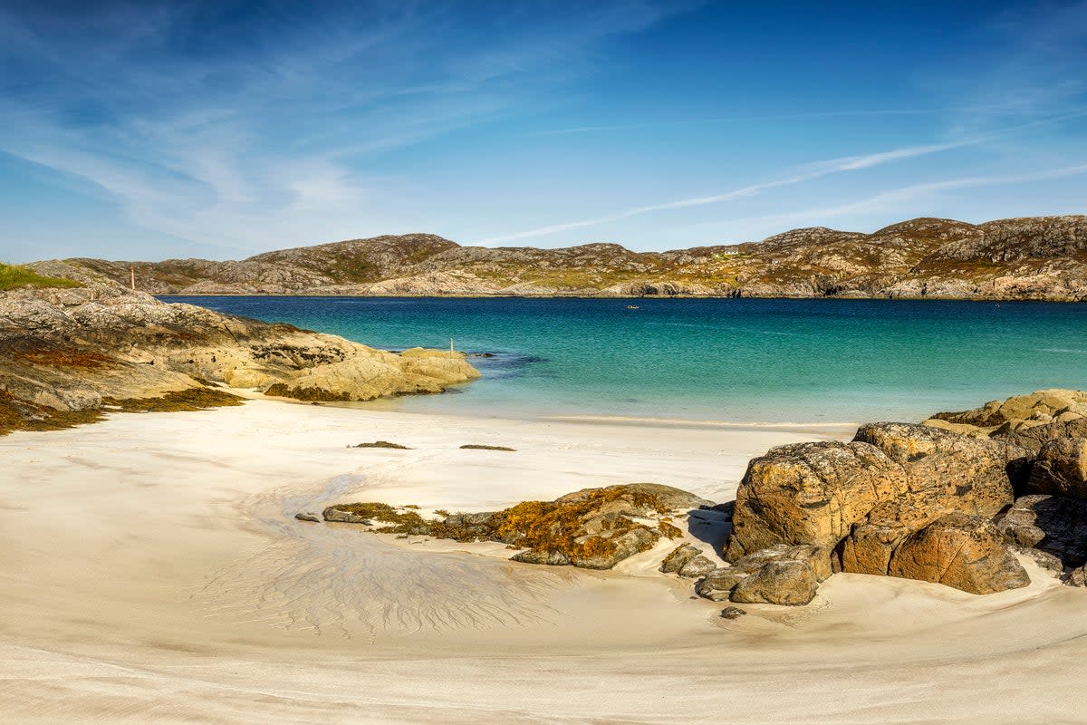 White sand and turquoise water form Achmelvich Bay (Getty Images/iStockphoto)