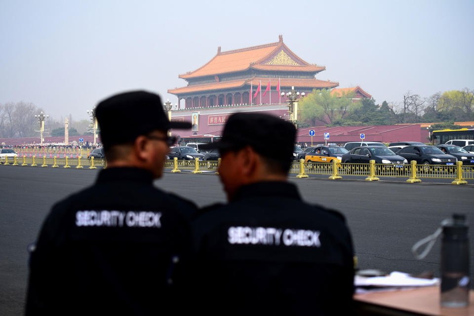 <p>Two security guards watch near the Tiananmen Square in Beijing on March 27, 2018. (Photo: Wang Zhao/AFP/Getty Images) </p>
