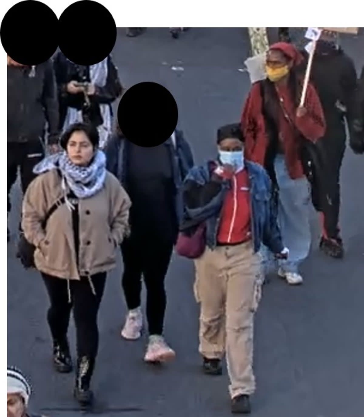 The women police want to speak to, walking towards Trafalgar Square during the pro-Palestinian rally (Metropolitan Police)