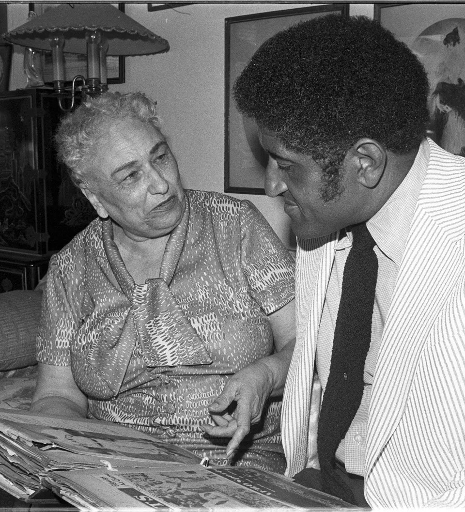 Effa Manley, left, who co-owned the Newark Eagles of the Negro National League, looks over a scrapbook with one of her former players, Don Newcombe in 1973.