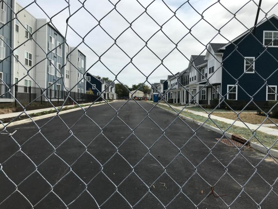 A chain-link fence keeps trespassers out of a construction zone at the new Branch Village homes in Camden's Centerville neighborhood.