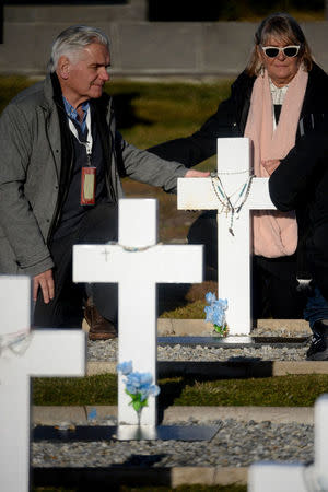 Relatives of Argentine soldiers who died during the Falklands War react during their visit to Darwin cemetery, in the Falkland Islands, March 26, 2018. Argentine Presidency/Handout via REUTERS