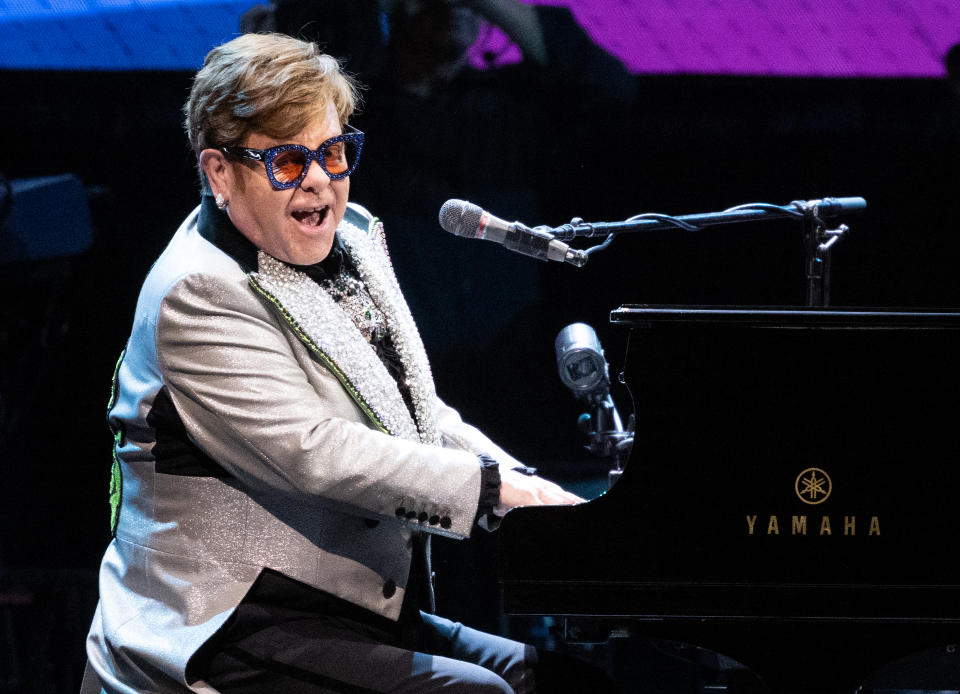 27 April 2023, Bavaria, Munich: Singer and pianist Elton John sits on stage at the Olympiahalle during a concert as part of his 