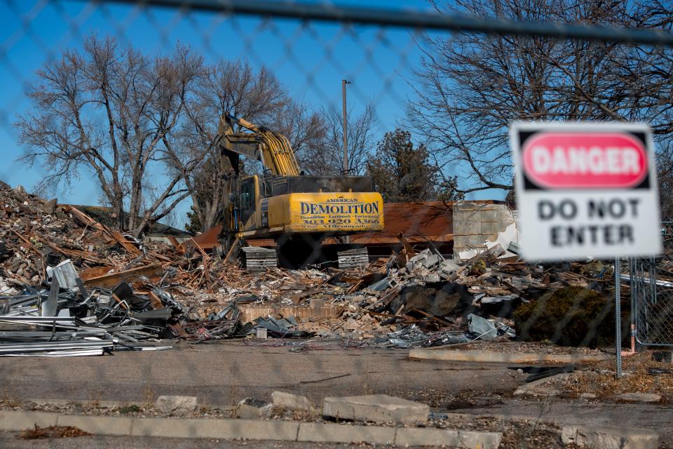 An excavator digs through rubble after the demolition of a former Radio Shack at 2505 S. College Ave. on Tuesday in Fort Collins.