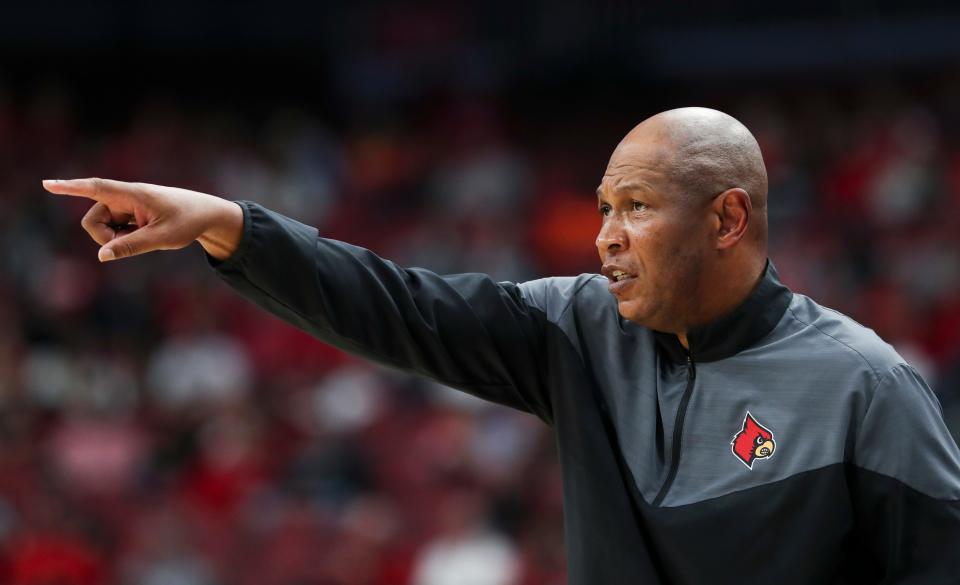 U of L head coach Kenny Payne calls a play against Maryland during their game at the Yum Center in Louisville, Ky. on Nov. 29, 2022.  
