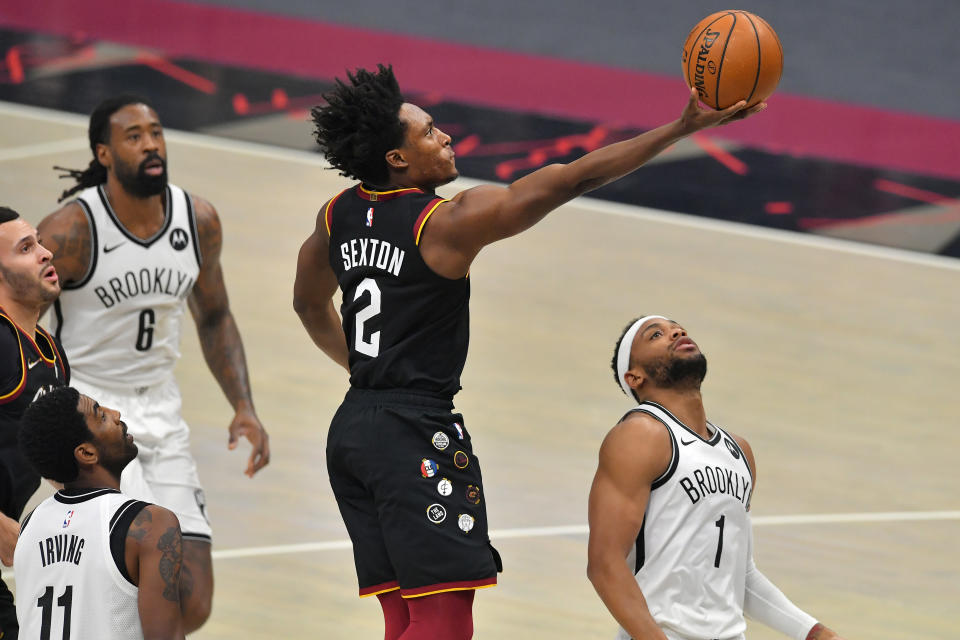 CLEVELAND, OHIO - JANUARY 22: Collin Sexton #2 of the Cleveland Cavaliers shoots over Bruce Brown #1 of the Brooklyn Nets during the first quarter at Rocket Mortgage Fieldhouse on January 22, 2021 in Cleveland, Ohio. NOTE TO USER: User expressly acknowledges and agrees that, by downloading and/or using this photograph, user is consenting to the terms and conditions of the Getty Images License Agreement. (Photo by Jason Miller/Getty Images)