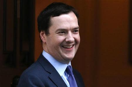 Britain's Chancellor of the Exchequer George Osborne stands outside 11 Downing Street in London February 4, 2014. REUTERS/Suzanne Plunkett