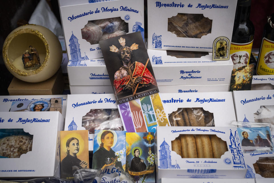 Handmade sweets made by the cloistered nuns of the Monjas Minimas monastery are displayed for sale at the door of a church in Jerez de la Frontera, southern Spain, on Tuesday, Dec. 5, 2023. It's the fortnight before Christmas and all through the world's Catholic convents, nuns and monks are extra busy preparing the traditional delicacies they sell to a loyal fan base even in rapidly secularizing countries. (AP Photo/Emilio Morenatti)