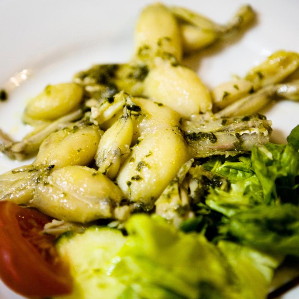 Frogs' legs are often served with parsley, garlic and butter - Photo by TanMan/ Moment RF