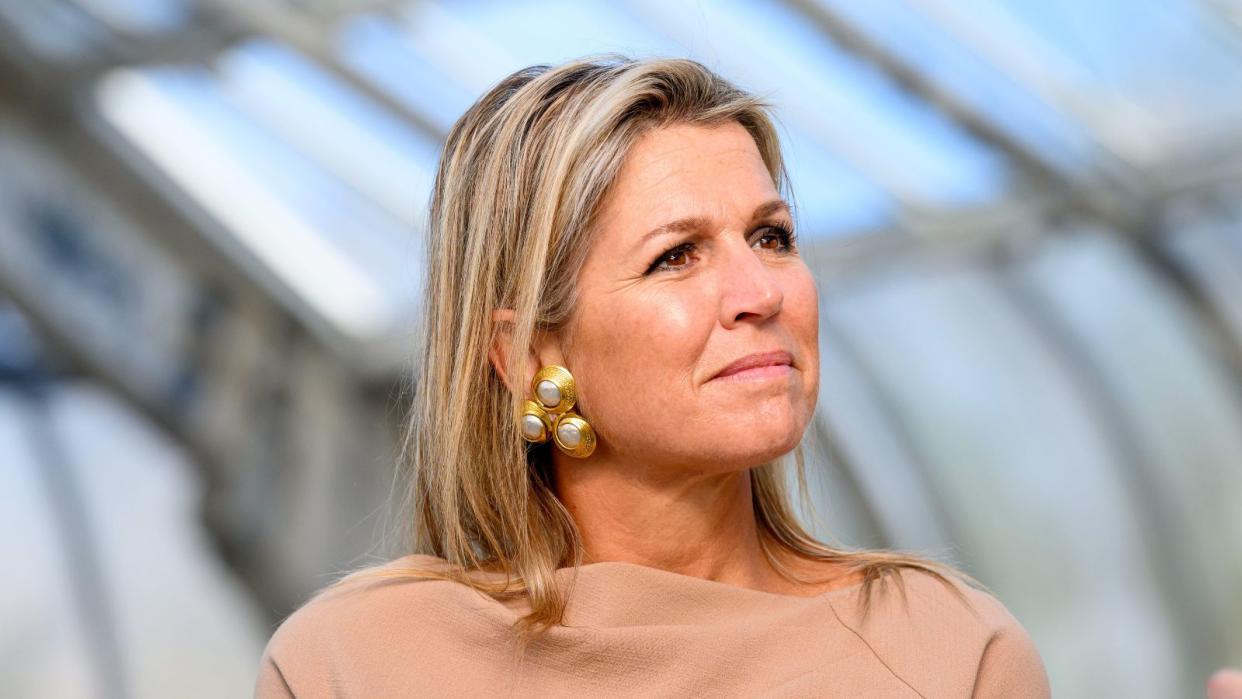  Queen Maxima's red wine nails were the perfect pop of colour as the Queen of the Netherlands stepped out in an all beige ensemble. 