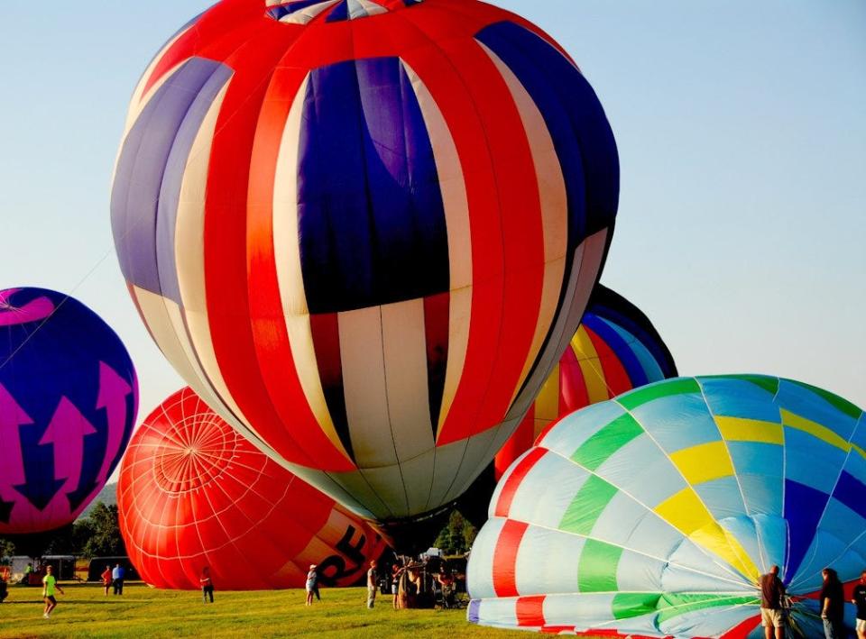 Hot air balloons begin to inflate at the Dansville Municipal Airport.