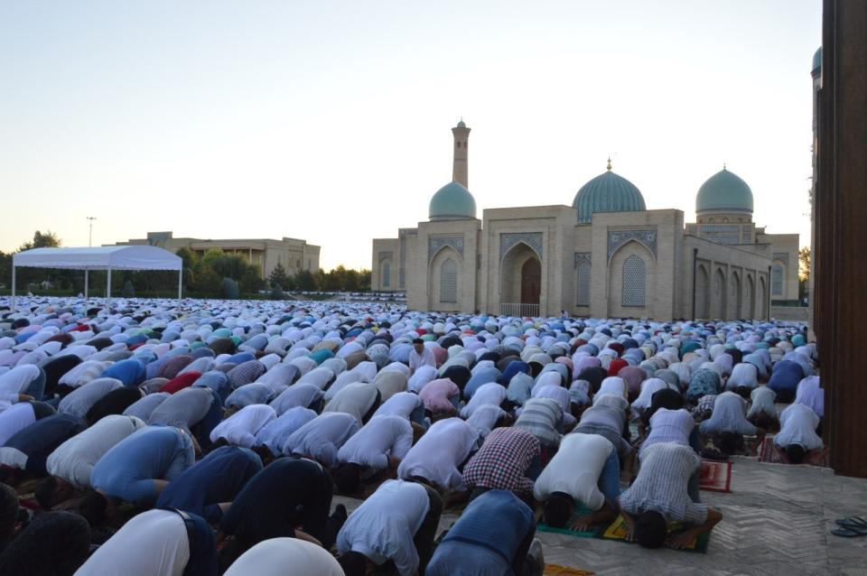 Muslims pray during the Eid al-Fitr holiday in Tashkent, Uzbekistan