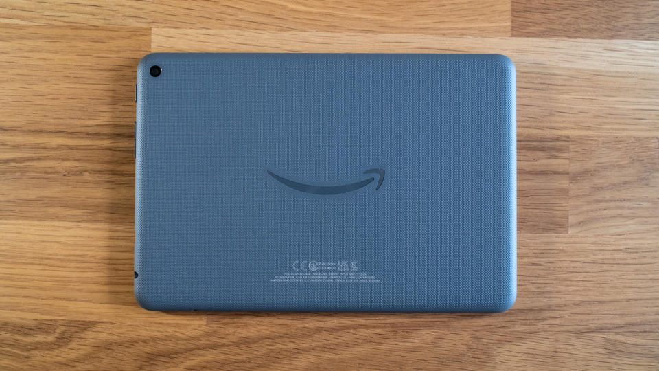 The back of an Amazon Fire HD 8 Plus on a wooden surface