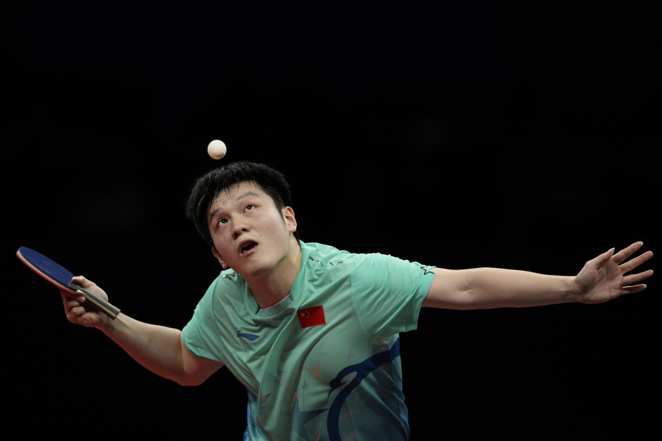 China's Fan Zhendong serves the ball against his compatriot Wang Chuqin during their Table Tennis Men's Singles Final match for the 19th Asian Games in Hangzhou, Monday, Oct. 2, 2023. (AP Photo/Ng Han Guan)