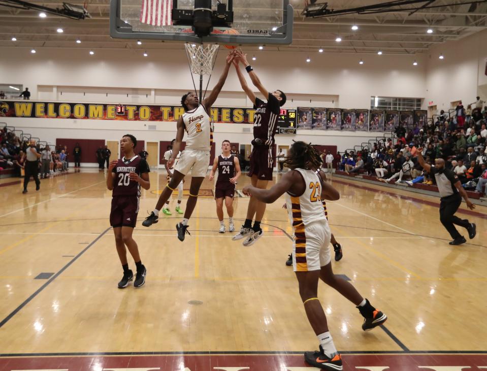 New Hampstead's Toland Daughtrey goes to the basket during Friday night's region championship game against Benedictine.