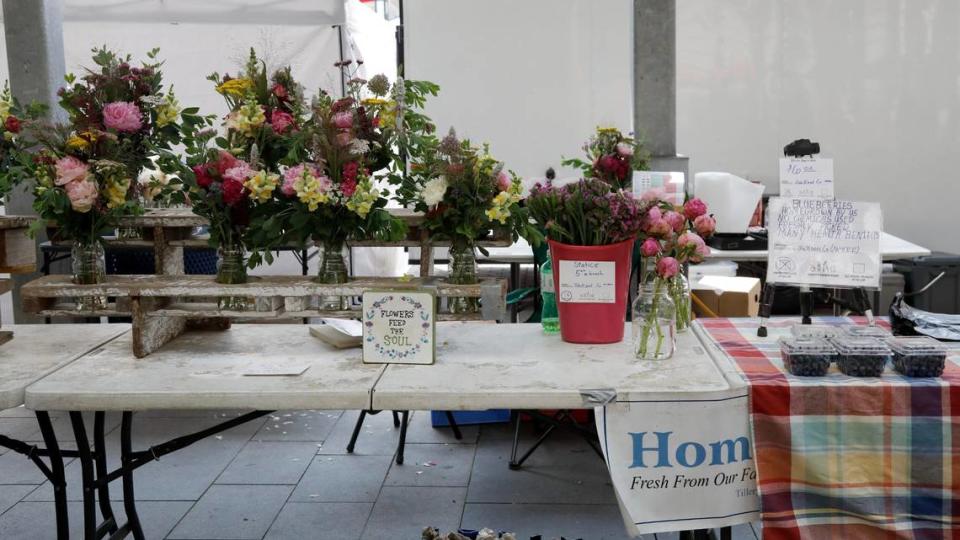 Home Pickins booth sits under the pavilion on Saturday, June 17, 2023 at the Fifth Third Pavilion in downtown Lexington, Ky. The booth’s items come from the Tillery Family Farm in McKee, Ky.