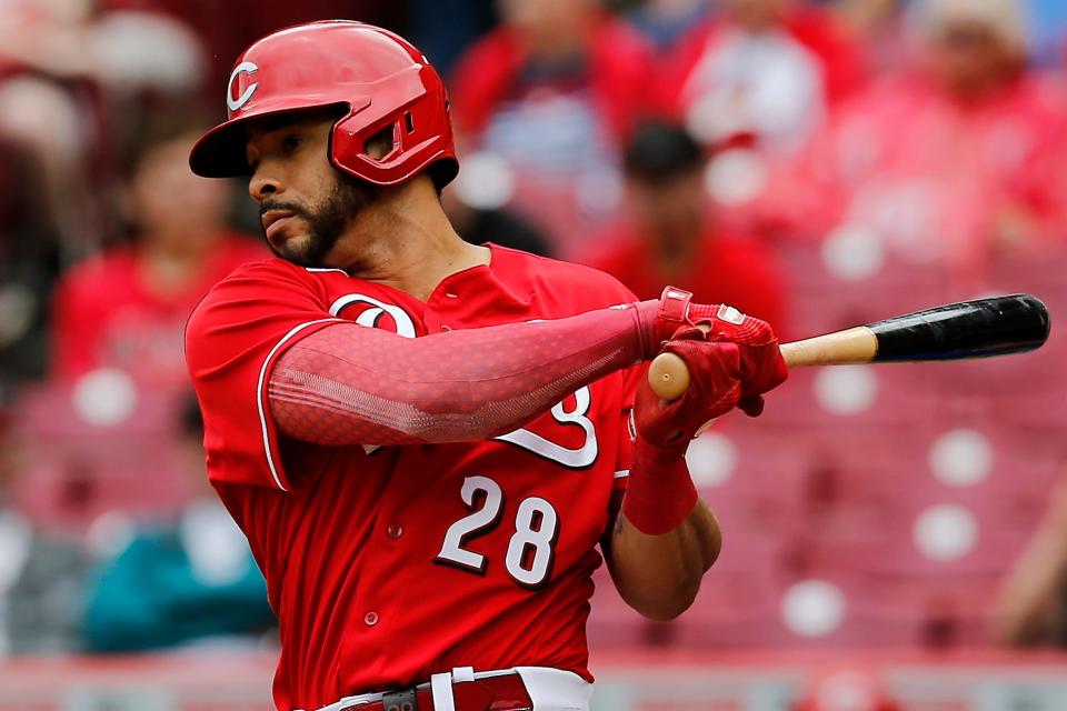 Cincinnati Reds designated hitter Tommy Pham (28) follows through as he ties the game with an RBI double in the third inning of the MLB National League game between the Cincinnati Reds and the Chicago Cubs at Great American Ball Park in downtown Cincinnati on Thursday, May 26, 2022. The Reds led 10-3 after three innings. 