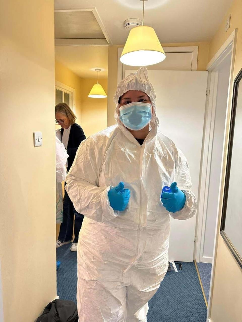 Sydni Stinnett’s forensic anthropology scene suit keeps her from accidentally contaminating a crime scene at the Cranfield University crime scene practice house Oct. 23, 2023.