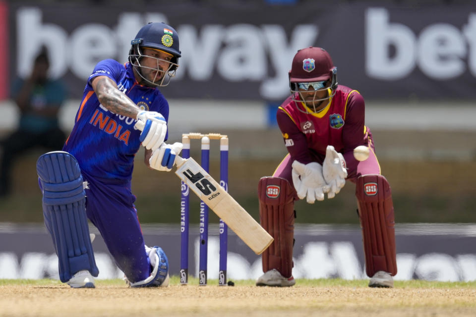 India's captain Shikhar Dhawan plays the shot to be caught for 97 runs by West Indies' Shamarh Brooks during the first ODI cricket match at Queen's Park Oval in Port of Spain, Trinidad and Tobago, Friday, July 22, 2022. (AP Photo/Ricardo Mazalan)