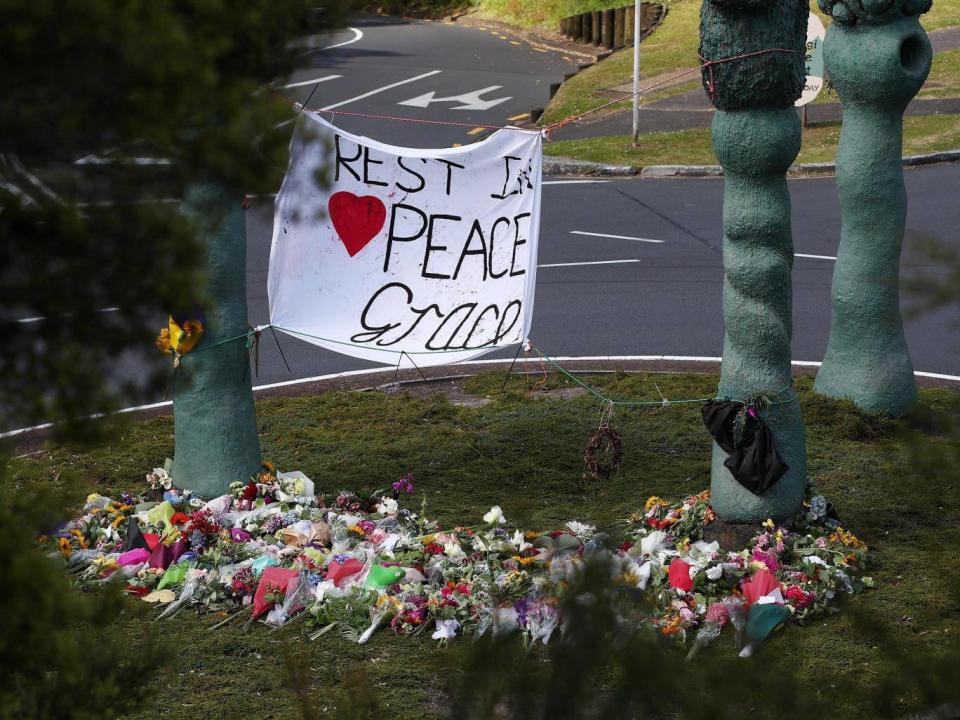 The floral tributes at the Titirangi roundabout grow larger for Grace Millane on 22 December, 2018 in Auckland, New Zealand. The British backpacker’s body was found in a section of bush just near Scenic Drive in West Auckland’s Waitakere Ranges on Sunday, following an extensive search. (Fiona Goodall/Getty Images)