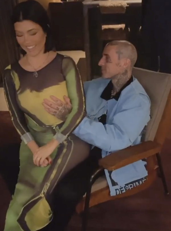 Travis with his hand on Kourt's breast