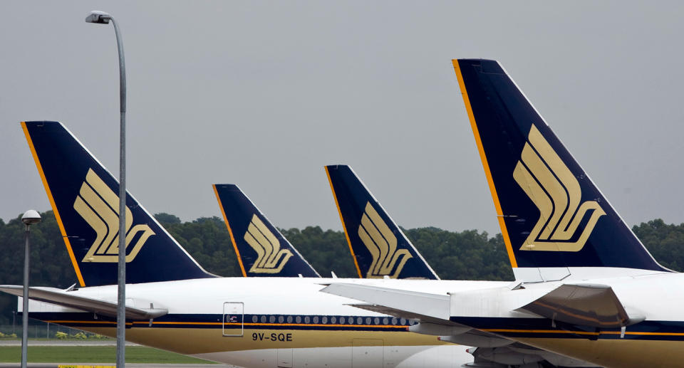 Singapore Airlines Ltd. airplanes sit on the tarmac at Changi Airport in Singapore. Source: File, Getty