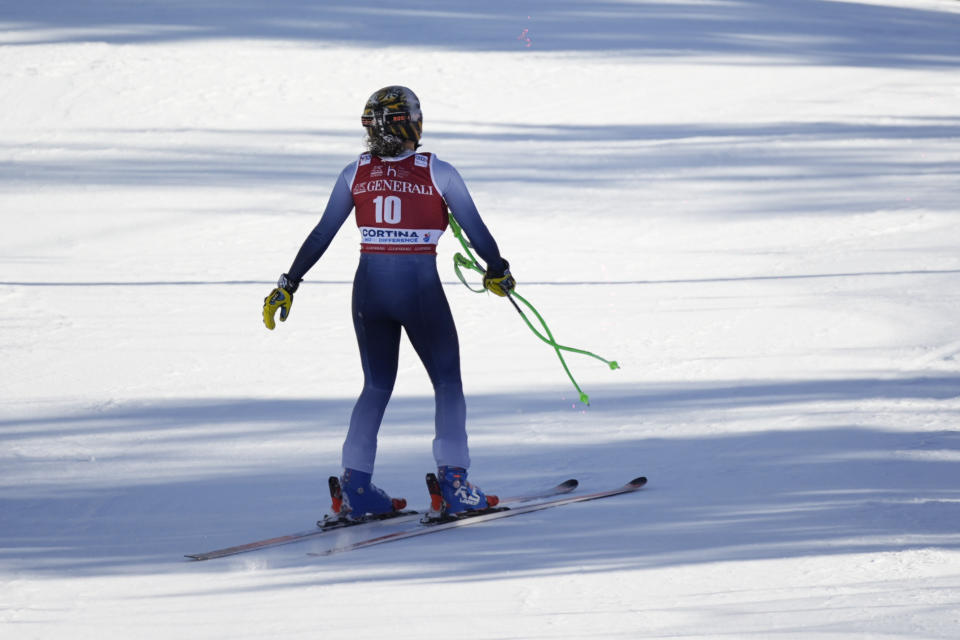 Italy's Federica Brignone skis down the course after crashing during an alpine ski, women's World Cup downhill race, in Cortina d'Ampezzo, Italy, Friday, Jan. 26, 2024. (AP Photo/Giovanni Zenoni)