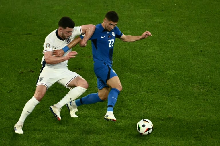 Slovenia midfielder Adam Gnezda Cerin (R) impressed against <a class="link " href="https://sports.yahoo.com/soccer/teams/england/" data-i13n="sec:content-canvas;subsec:anchor_text;elm:context_link" data-ylk="slk:England;sec:content-canvas;subsec:anchor_text;elm:context_link;itc:0">England</a> as his team made history by reaching the Euro 2024 last 16 (Angelos Tzortzinis)