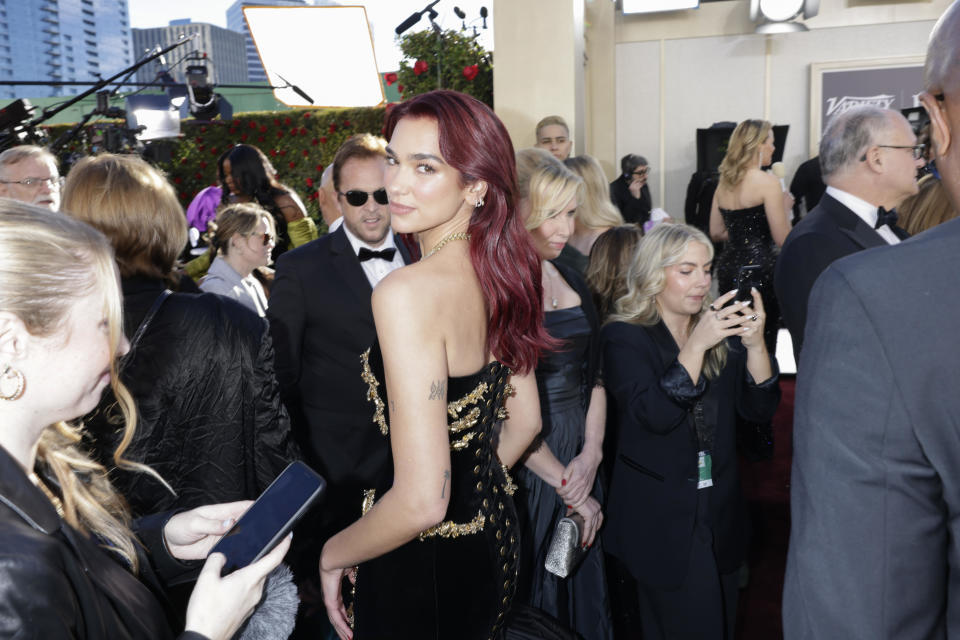 Dua Lipa arrives at the 81st Golden Globe Awards. / Credit: Francis Specker/CBS via Getty Images