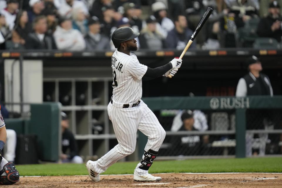 Chicago White Sox's Luis Robert Jr. watches his home run during the fourth inning of the team's baseball game against the Houston Astros on Saturday, May 13, 2023, in Chicago. (AP Photo/Erin Hooley)