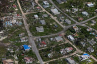 <p>Houses are seen in ruins in Codrington on the island of Barbuda just after a month after Hurricane Irma struck the Caribbean islands of Antigua and Barbuda, October 7, 2017. REUTERS/Shannon Stapleton </p>