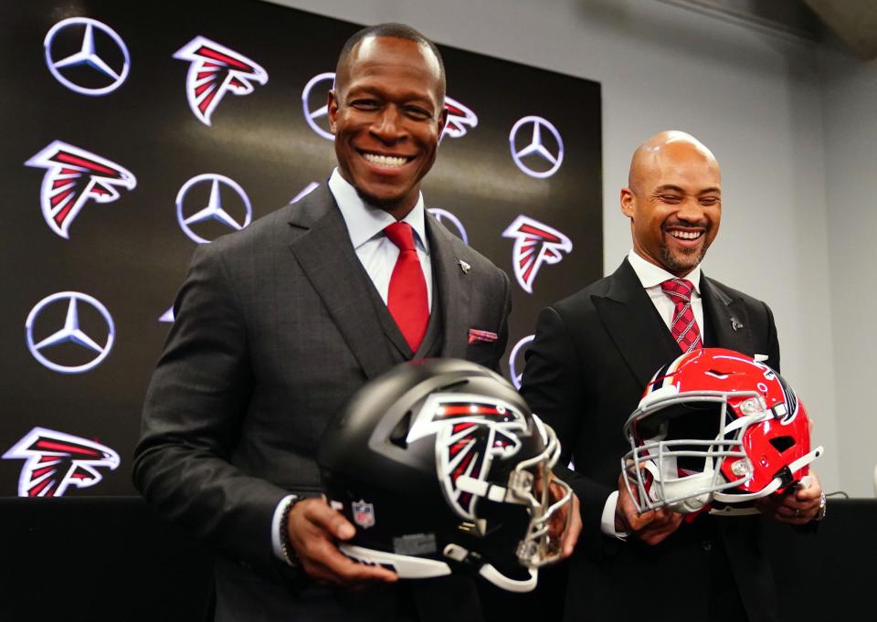 Feb 5, 2024; Atlanta, GA, USA; Atlanta Falcons head coach Raheem Morris and general manager Terry Fontenot pose for the media after Morris was introduced as the head coach of the Atlanta Falcons at Mercedes-Benz Stadium. Mandatory Credit: John David Mercer-USA TODAY Sports