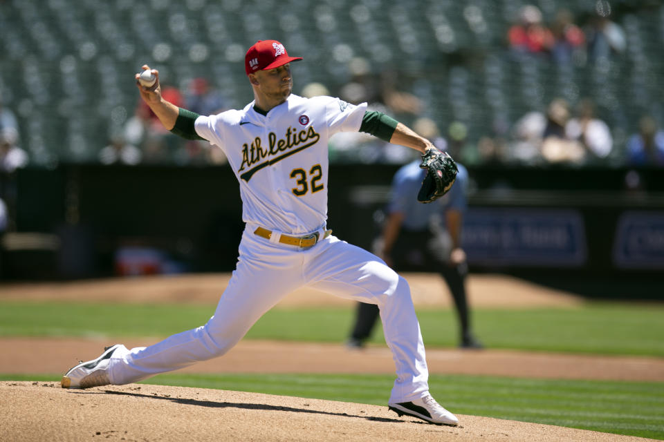 Oakland Athletics starting pitcher James Kaprielian (32) delivers against the Boston Red Sox during the first inning of a baseball game, Sunday, July 4, 2021, in Oakland, Calif. (AP Photo/D. Ross Cameron)