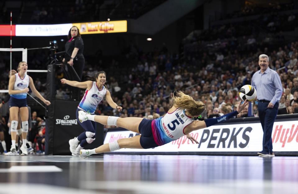 THIS CORRECTS THE SPELLING TO BROOKE, NOT BROOK AS ORIGINALLY SENT - Omaha Supernovas' Brooke Nuneviller (5) dives for the ball against THE Atlanta Vibe during a Pro Volleyball Federation game Wednesday, Jan. 24, 2024, in Omaha, Neb. (AP Photo/Rebecca S. Gratz)