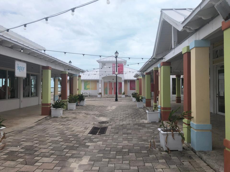 A in Mimini street with colorful buildings and strings of lights.