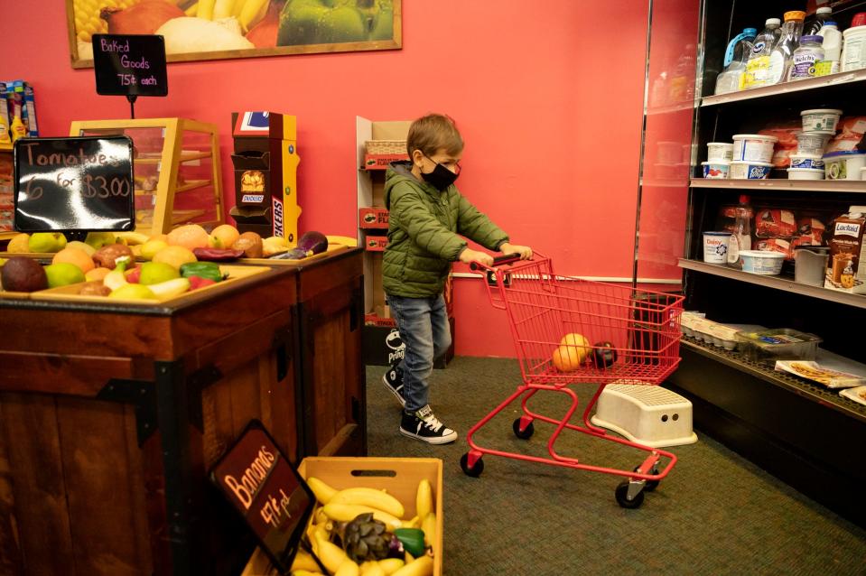 Hudson Coblentz, 4, plays with toy groceries on Wednesday, Oct. 27, 2021 at Kids-N-Stuff  Children's Museum in Albion, Michigan. 