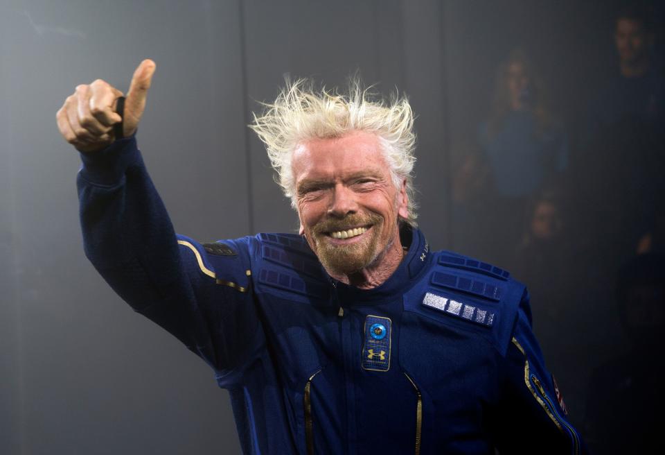 Virgin Galactic Founder Sir Richard Branson demonstrates a spacewear system, designed for Virgin Galactic astronauts, at an event October 16, 2019 in Yonkers, New York. - At the event Virgin Galactic and Under Armour unveiled the worlds first exclusive spacewear system for private astronauts. (Photo by Don Emmert / AFP) (Photo by DON EMMERT/AFP via Getty Images)