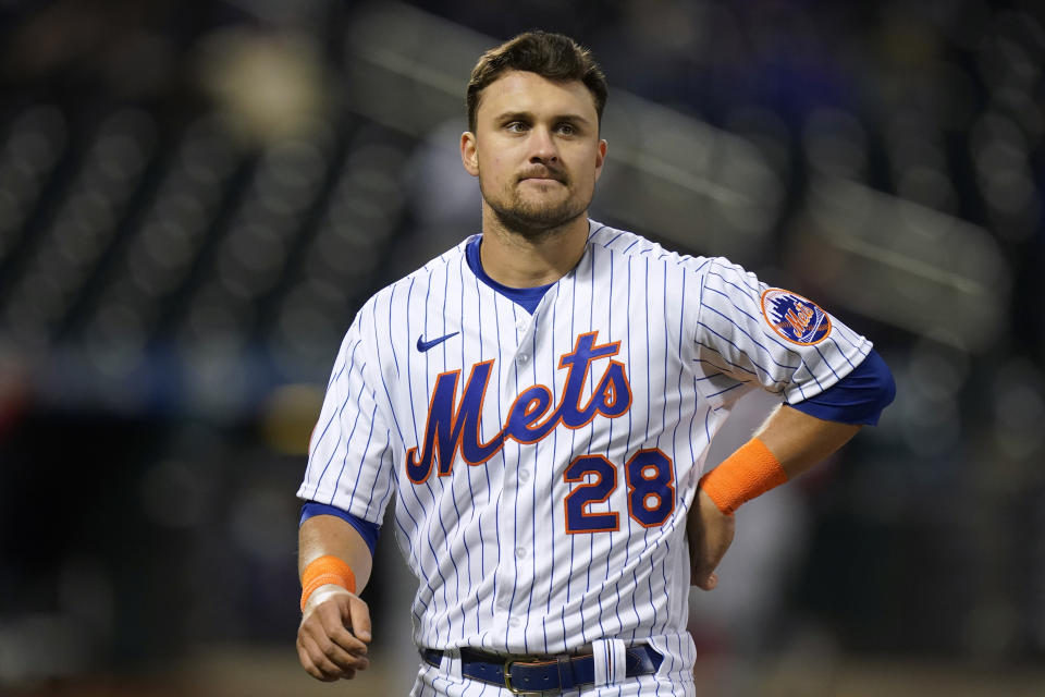 New York Mets' J.D. Davis reacts at the end of the fourth inning of the team's baseball game against the Boston Red Sox on Tuesday, April 27, 2021, in New York. (AP Photo/Frank Franklin II)