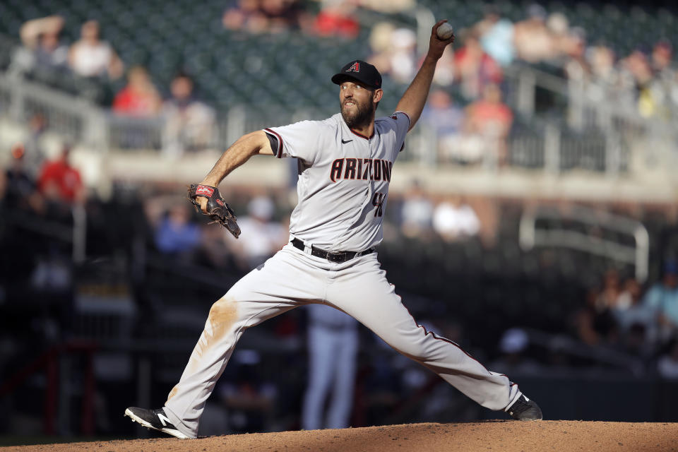 Arizona Diamondbacks pitcher Madison Bumgarner works against the Atlanta Braves in the seventh inning of the second baseball game of a double header Sunday, April 25, 2021, in Atlanta. (AP Photo/Ben Margot)