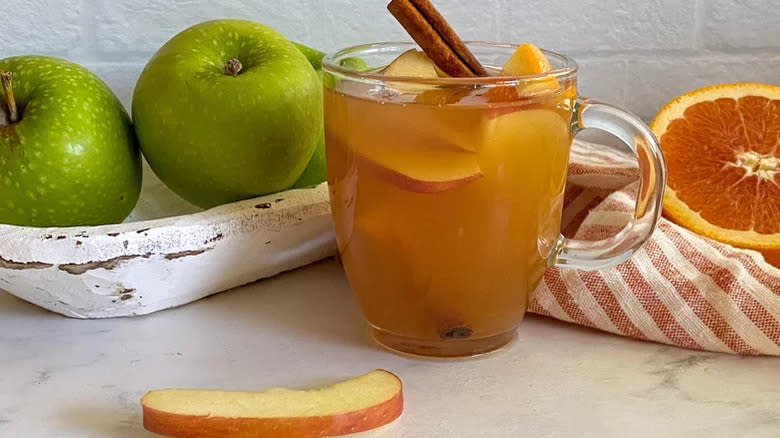 Apple cider with cinnamon and apples